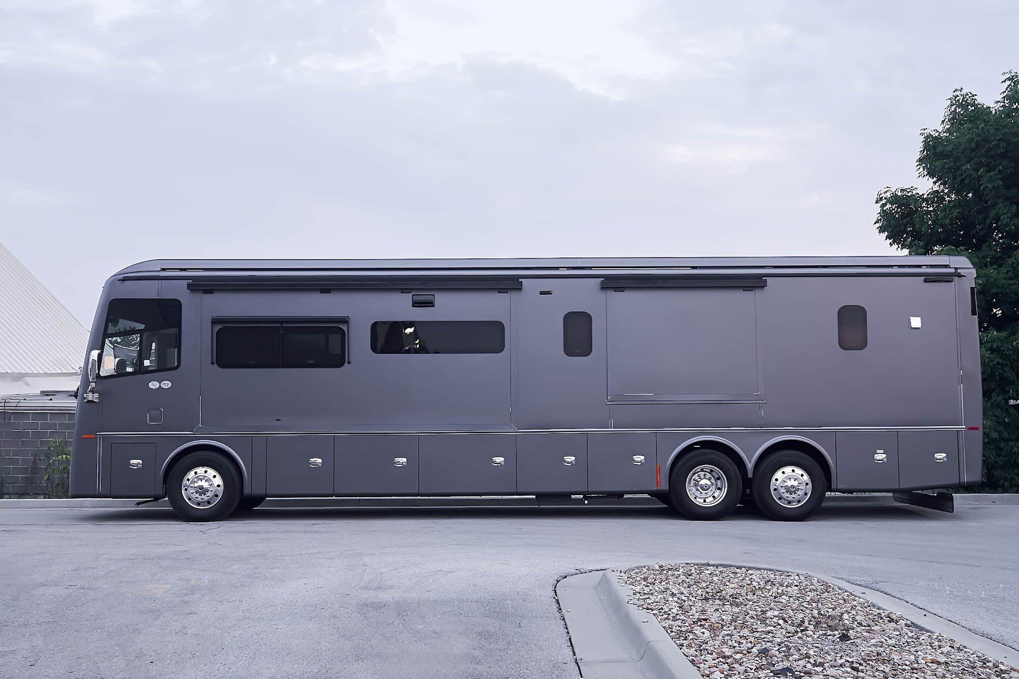 Wide side profile of the completed matte gray Tiffin motorcoach wrap (project photo 203)