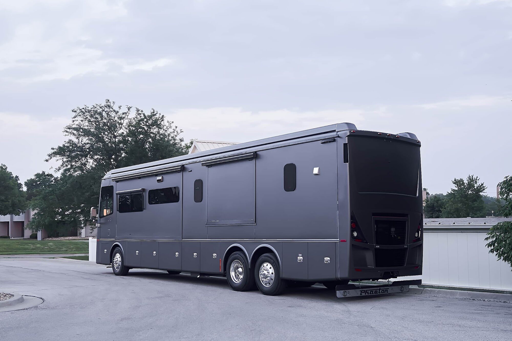 Wide rear three-quarter view of the completed Tiffin motorcoach wrap (project photo 205)
