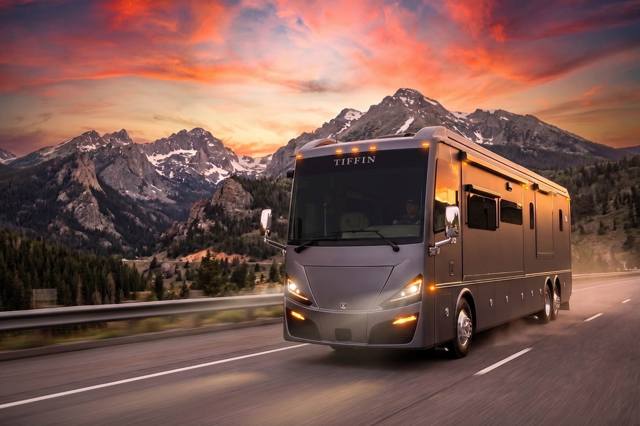 Tiffin motorcoach on a mountain road at sunset
