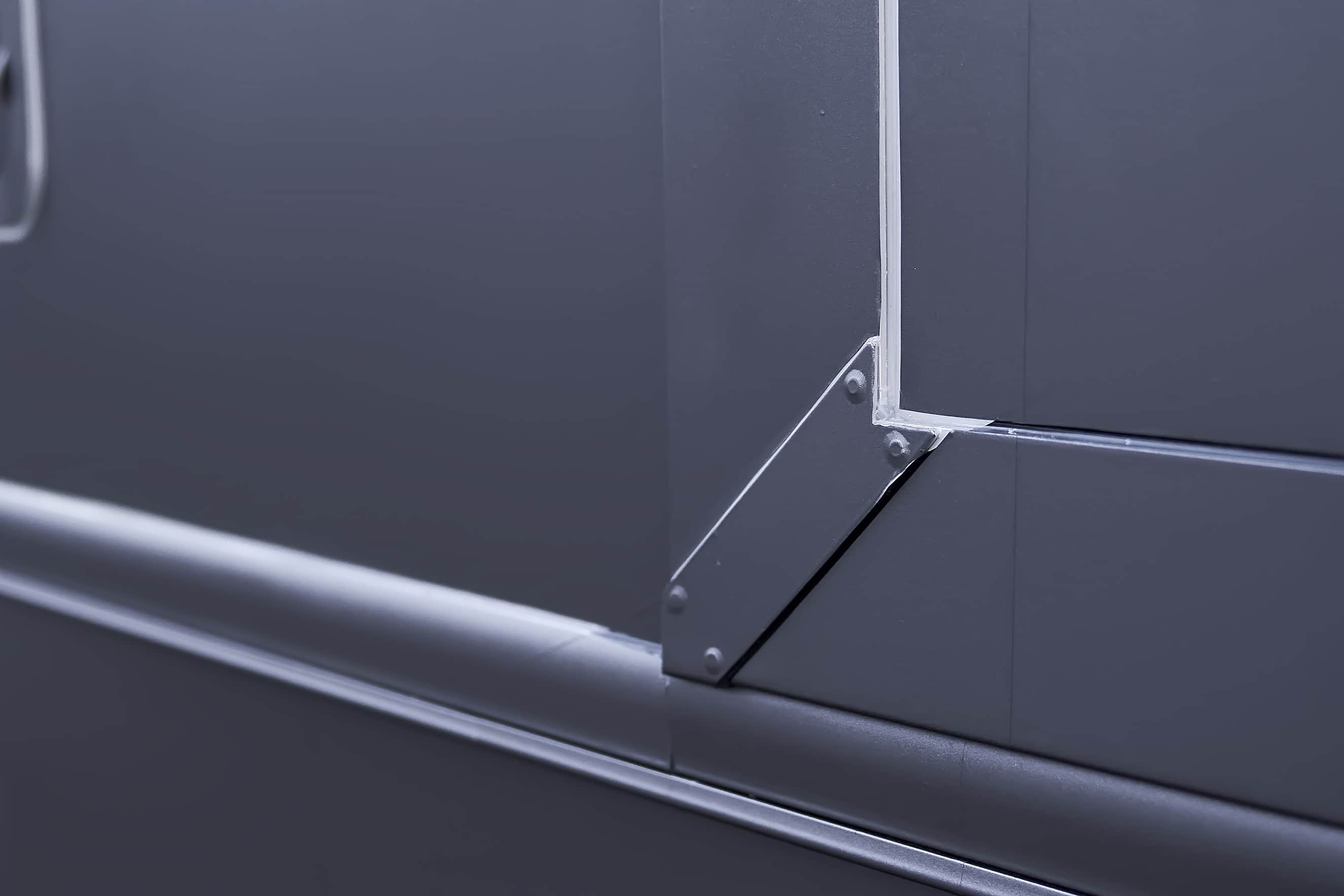 Close-up of clean vinyl wrap edges around a motorcoach panel (project photo 218)