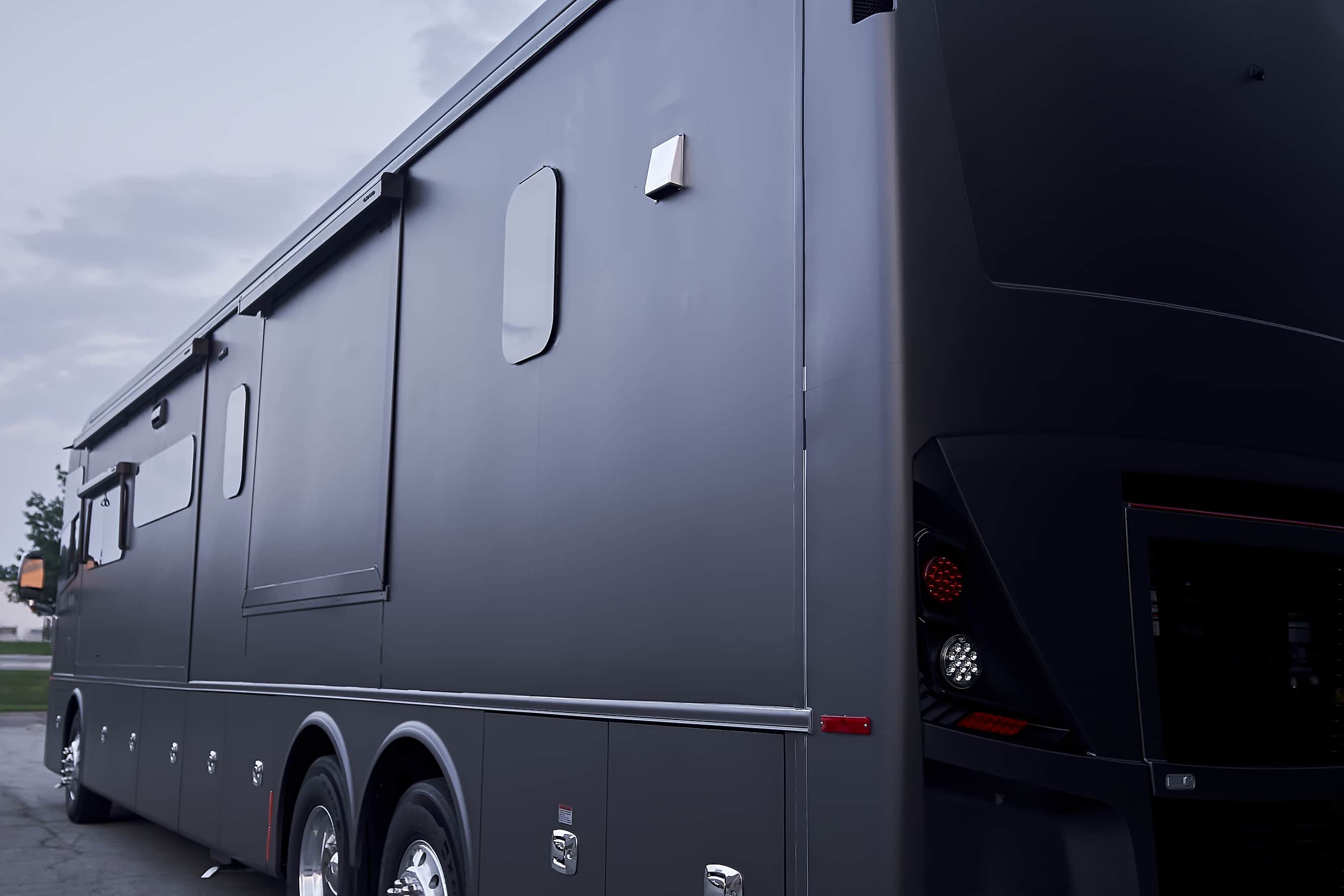 Rear-side medium view of the completed Tiffin motorcoach wrap (project photo 206)