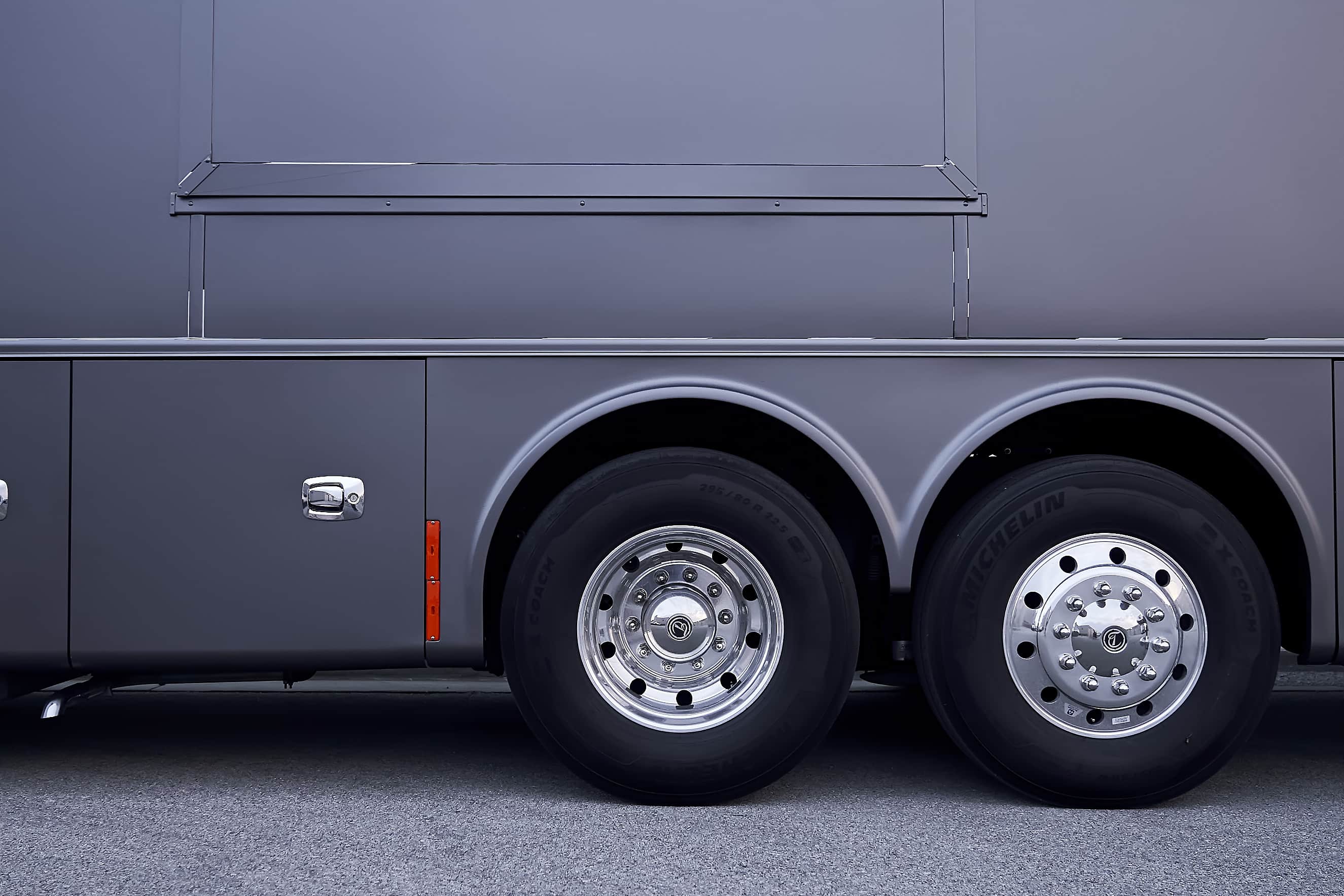 Close-up of the finished motorcoach wrap and rear wheels (project photo 207)