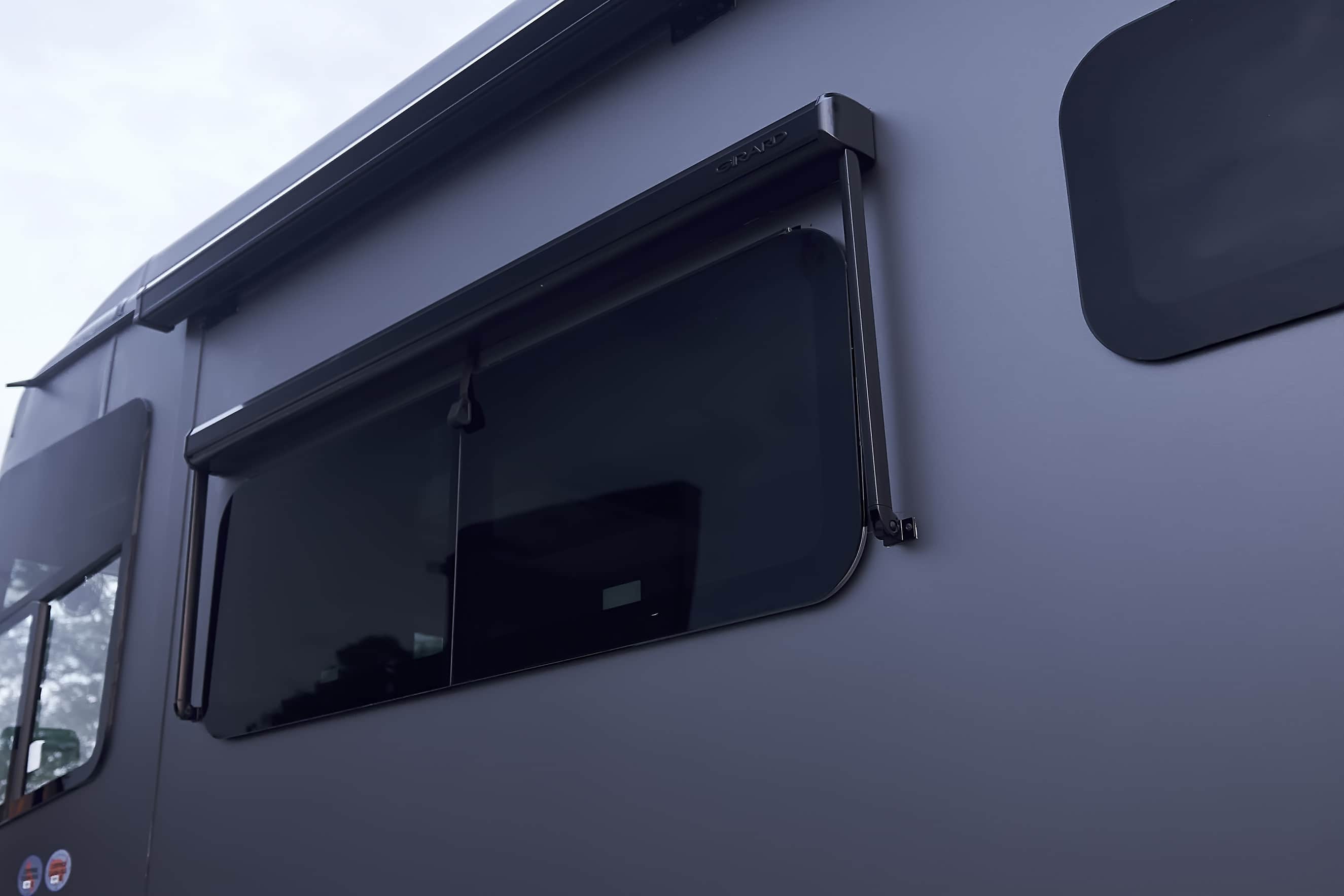 Finished vinyl wrap around a motorcoach side window (project photo 208)